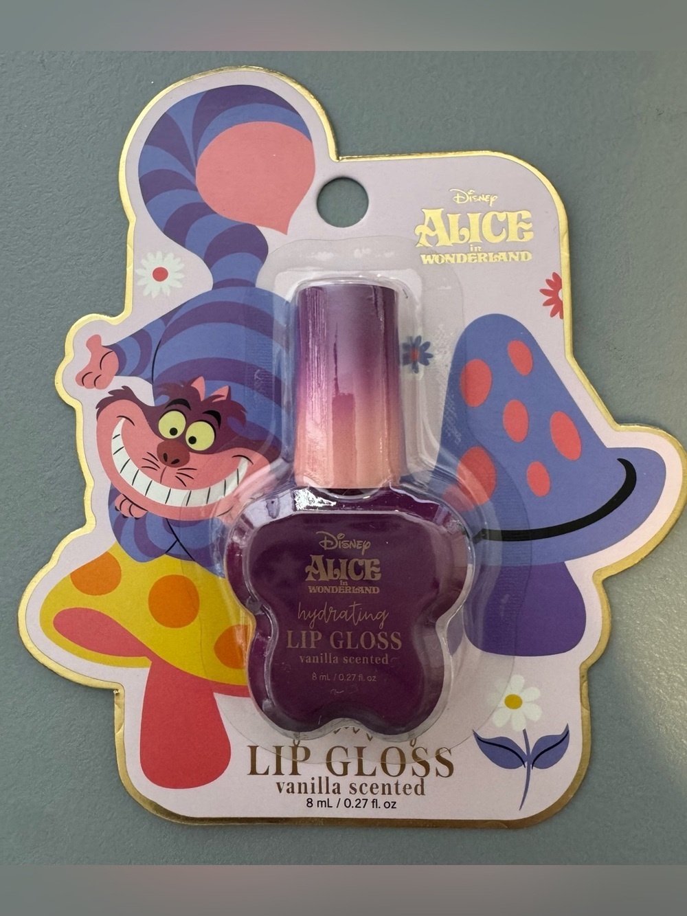 Disney Alice in Wonderland Hydrating Lip Gloss vanilla scented cheesier cat plum